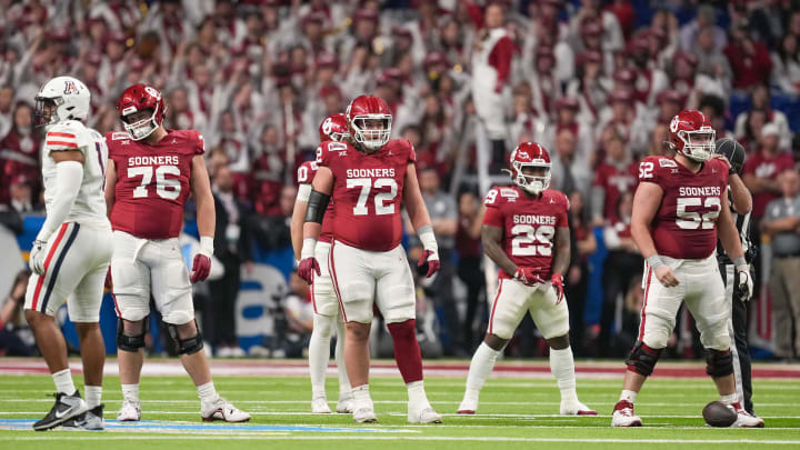 Dec 28, 2023; San Antonio, TX, USA; Oklahoma Sooners offensive linemen Jacob Sexton (76), McKade Mettauer (72), and Troy Everett (52) get ready for a play in the first half against the Arizona Wildcats at Alamodome. Mandatory Credit: Daniel Dunn-USA TODAY Sports Dec 28, 2023; San Antonio, TX, USA; Oklahoma Sooners offensive linemen Jacob Sexton (76), McKade Mettauer (72), and Troy Everett (52) get ready for a play in the first half against the Arizona Wildcats at Alamodome. Mandatory Credit: Daniel Dunn-USA TODAY Sports