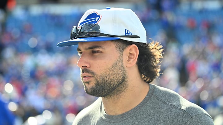 Nov 3, 2024; Orchard Park, New York, USA; Buffalo Bills linebacker Matt Milano (58) on the field in street clothes before a game against the Miami Dolphins at Highmark Stadium. Mandatory Credit: Mark Konezny-Imagn Images