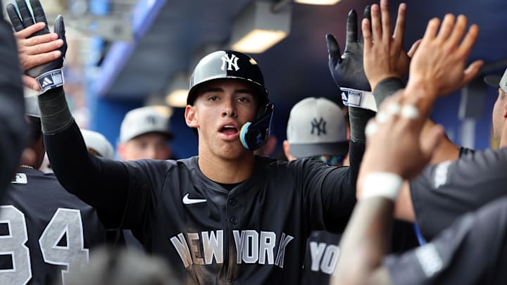 Feb 22, 2025; Dunedin, Florida, USA;  New York Yankees shortstop George Lombard Jr. (96)  is congratulated after he scored a run during the sixth inning against the Toronto Blue Jays at TD Ballpark. Mandatory Credit: Kim Klement Neitzel-Imagn Images