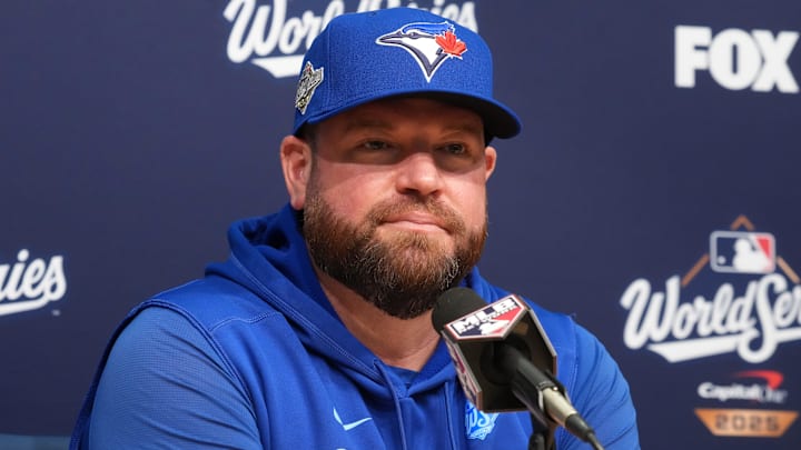 Blue Jays manager' John Schneider speaking at a press conference during the World Series 