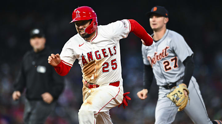 May 3, 2025; Anaheim, California, USA; Los Angeles Angels catcher Travis d'Arnaud (25) forced out at first base during a rundown against Detroit Tigers shortstop Trey Sweeney (27) during the fourth inning at Angel Stadium. Mandatory Credit: Jonathan Hui-Imagn Images May 3, 2025; Anaheim, California, USA; Los Angeles Angels catcher Travis d'Arnaud (25) forced out at first base during a rundown against Detroit Tigers shortstop Trey Sweeney (27) during the fourth inning at Angel Stadium. Mandatory Credit: Jonathan Hui-Imagn Images
