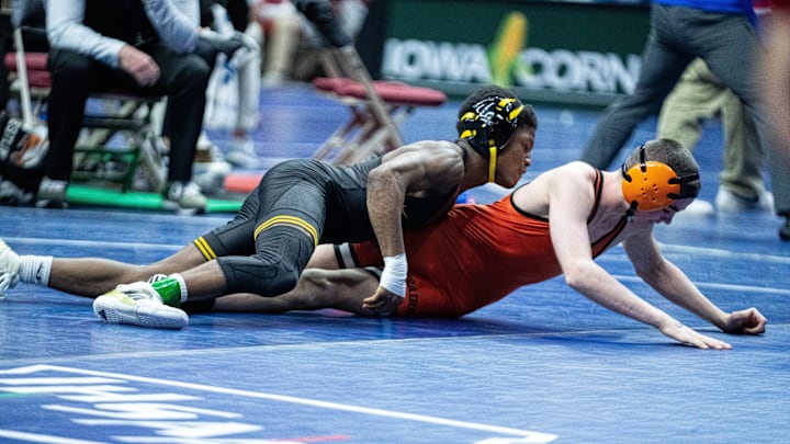 Southeast Polk’s Amir Newman-Winfrey wrestles Cedar Rapids Prairie’s Kiernan Dunlay at 106 lbs. on Feb. 18, 2026, at Casey’s Center in Des Moines. Southeast Polk’s Amir Newman-Winfrey wrestles Cedar Rapids Prairie’s Kiernan Dunlay at 106 lbs. on Feb. 18, 2026, at Casey’s Center in Des Moines.