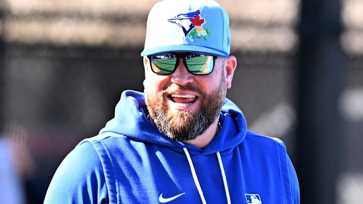 Toronto Blue Jays manager John Schneider (14) watches his team work out during spring training at Bobby Mattick Training Center at Englebert Complex