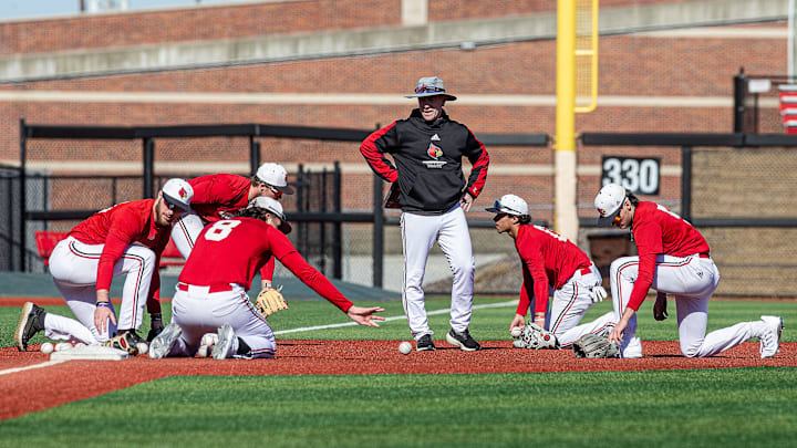 Louisville baseball coach Dan McDonnell looked on during team drills at Jim Patterson Stadium on Tuesday, Feb. 13, 2024.