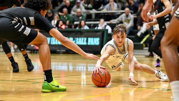 League MVP Carter Hansen and Auburn won 4A NSPL championship this winter.