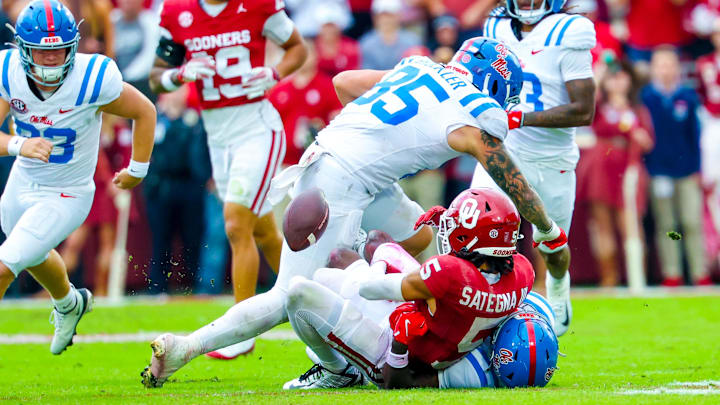 Oklahoma wide receiver Isaiah Sategna III (5) fumbles a punt return in front of Ole Miss Rebels tight end Trace Bruckler (85) during the second half at Gaylord Family-Oklahoma Memorial Stadium on Saturday.