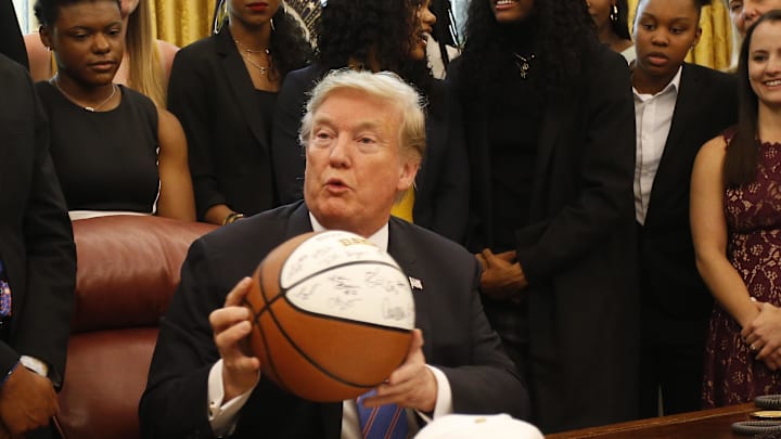 Apr 29, 2019; Washington, D.C., USA; President Donald Trump holds a gifted team autographed basketball at a ceremony honoring the 2019 women s NCAA basketball champion Baylor Lady Bears in the Oval Office at the White House. Mandatory Credit: Geoff Burke-Imagn Images