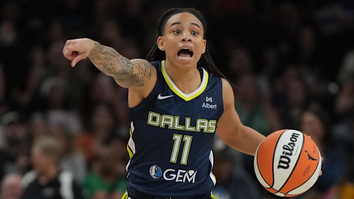 Jul 7, 2025; Phoenix, Arizona, USA; Dallas Wings guard JJ Quinerly (11) drives against the Phoenix Mercury in the first half at Footprint Center. Mandatory Credit: Rick Scuteri-Imagn Images Jul 7, 2025; Phoenix, Arizona, USA; Dallas Wings guard JJ Quinerly (11) drives against the Phoenix Mercury in the first half at Footprint Center. Mandatory Credit: Rick Scuteri-Imagn Images