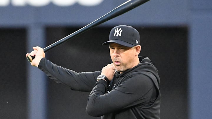 Oct 3, 2025; Toronto, Ontario, Canada; New York Yankees manager Aaron Boone (17) watches his players during workouts at Rogers Centre. Mandatory Credit: Dan Hamilton-Imagn Images