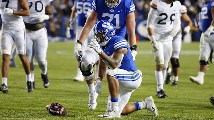 Oct 30, 2021; Provo, Utah, USA; Brigham Young Cougars running back Tyler Allgeier (25) reacts after running for a first down in third quarter against the Virginia Cavaliers at LaVell Edwards Stadium. Mandatory Credit: Jeffrey Swinger-Imagn Images Oct 30, 2021; Provo, Utah, USA; Brigham Young Cougars running back Tyler Allgeier (25) reacts after running for a first down in third quarter against the Virginia Cavaliers at LaVell Edwards Stadium. Mandatory Credit: Jeffrey Swinger-Imagn Images