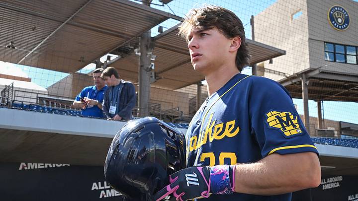 Milwaukee Brewers infield prospect Josh Adamczewski walks along the dugout during spring training workouts Tuesday, February 17, 2026, at American Family Fields of Phoenix in Phoenix, Arizona. Milwaukee Brewers infield prospect Josh Adamczewski walks along the dugout during spring training workouts Tuesday, February 17, 2026, at American Family Fields of Phoenix in Phoenix, Arizona.