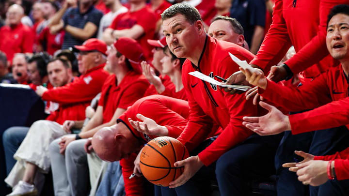 Arizona Wildcats head coach Tommy Lloyd looks at the referee after BYU Cougars guard Trey Stewart (1) threw the ball at him by accident during the second half at McKale Center.