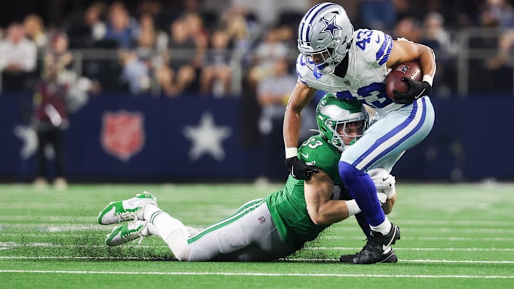 Nov 23, 2025; Arlington, Texas, USA; Dallas Cowboys running back Malik Davis (43) is brought down by Philadelphia Eagles cornerback Cooper Dejean (33) in the third quarter at AT&T Stadium. Nov 23, 2025; Arlington, Texas, USA; Dallas Cowboys running back Malik Davis (43) is brought down by Philadelphia Eagles cornerback Cooper Dejean (33) in the third quarter at AT&T Stadium.