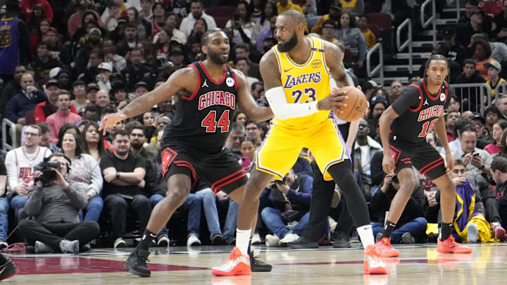 Mar 27, 2025; Chicago, Illinois, USA; Chicago Bulls forward Patrick Williams (44) defends Los Angeles Lakers forward LeBron James (23) during the first quarter at United Center. Mandatory Credit: David Banks-Imagn Images