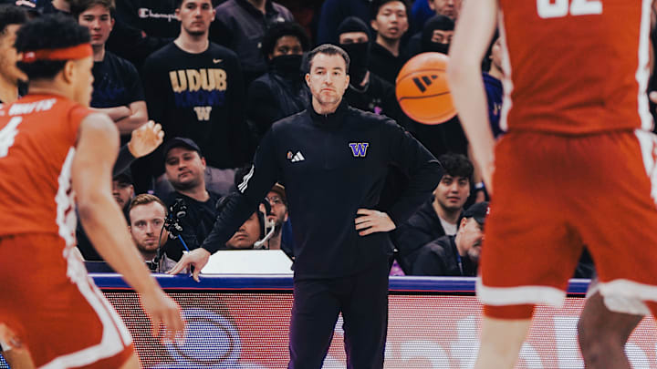 Danny Sprinkle watches the Huskies face Illinois. 