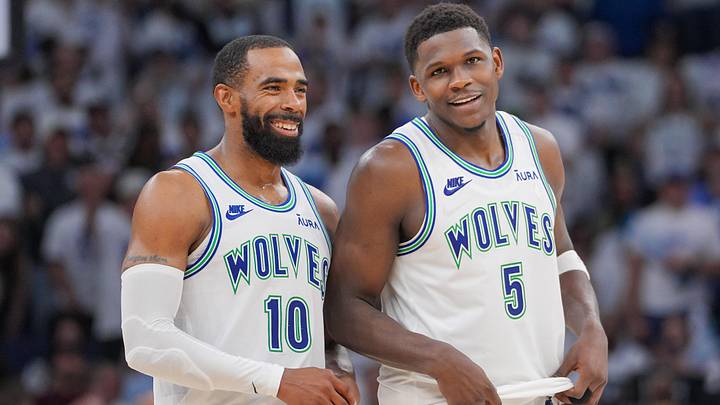May 16, 2024; Minneapolis, Minnesota, USA; Minnesota Timberwolves guard Mike Conley (10) and guard Anthony Edwards (5) talk against the Denver Nuggets in the fourth quarter during game six of the second round for the 2024 NBA playoffs at Target Center. 