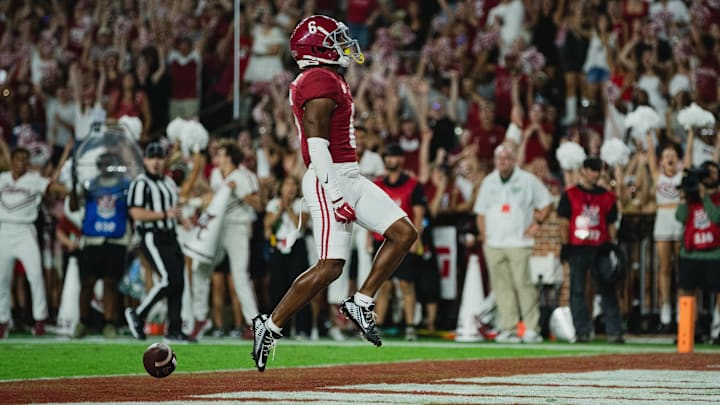 Sep 7, 2024; Tuscaloosa, Alabama, USA; Alabama Crimson Tide wide receiver Kobe Prentice (6) scores a touchdown against the South Florida Bulls during the fourth quarter at Bryant-Denny Stadium. Mandatory Credit: William McLelland-Imagn Images