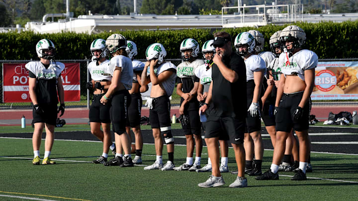 Head coach Ben McEnroe directs his team during a Thousand Oaks High football practice. Head coach Ben McEnroe directs his team during a Thousand Oaks High football practice.