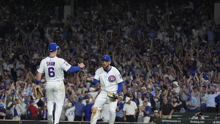 Oct 2, 2025; Chicago, Illinois, USA; Chicago Cubs first baseman Michael Busch (29) and third baseman Matt Shaw (6) celebrate defeating the San Diego Padres during game three of the Wildcard round for the 2025 MLB playoffs at Wrigley Field. Mandatory Credit: David Banks-Imagn Images Oct 2, 2025; Chicago, Illinois, USA; Chicago Cubs first baseman Michael Busch (29) and third baseman Matt Shaw (6) celebrate defeating the San Diego Padres during game three of the Wildcard round for the 2025 MLB playoffs at Wrigley Field. Mandatory Credit: David Banks-Imagn Images