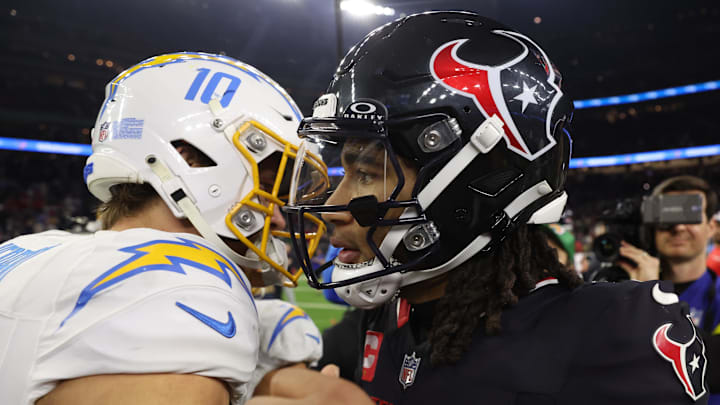 Jan 11, 2025; Houston, Texas, USA; Houston Texans quarterback C.J. Stroud (7) and Los Angeles Chargers quarterback Justin Herbert (10) after defeating the Los Angeles Chargers in an AFC wild card game at NRG Stadium. Mandatory Credit: Thomas Shea-Imagn Images