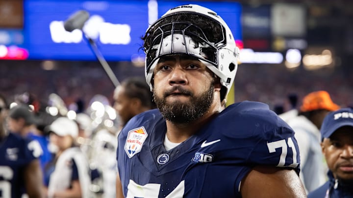 Dec 31, 2024; Glendale, AZ, USA; Penn State Nittany Lions offensive lineman Olaivavega Ioane (71) against the Boise State Broncos during the Fiesta Bowl at State Farm Stadium. Mandatory Credit: Mark J. Rebilas-Imagn Images
