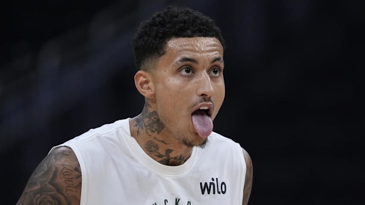 Mar 8, 2025; Milwaukee, Wisconsin, USA; Milwaukee Bucks forward Kyle Kuzma (18) reacts during pregame warmups before a game against the Orlando Magic at Fiserv Forum. Mandatory Credit: Michael McLoone-Imagn Images