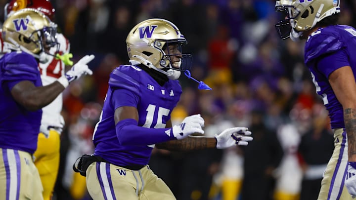 Huskies wide receiver Keith Reynolds (15) celebrates after rushing for a touchdown against USC during the fourth quarter.
