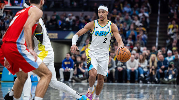 Feb 20, 2025; Indianapolis, Indiana, USA; Indiana Pacers guard Andrew Nembhard (2) dribbles the ball  in the second half against the Memphis Grizzlies at Gainbridge Fieldhouse. Mandatory Credit: Trevor Ruszkowski-Imagn Images