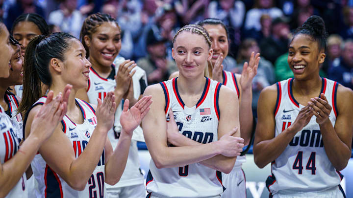 Mar 2, 2025; Storrs, Connecticut, USA; UConn Huskies guard Paige Bueckers (5) reacts after being inducted into the Huskies Women of Honor during senior night after the game against the Marquette Golden Eagles at Harry A. Gampel Pavilion. Mandatory Credit: David Butler II-Imagn Images