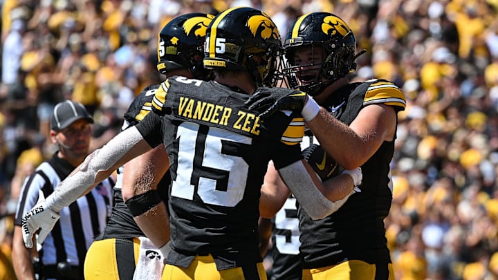 Aug 31, 2024; Iowa City, Iowa, USA; Iowa Hawkeyes wide receiver Reece Vander Zee (15) and tight end Luke Lachey (85) react after a touchdown by Vander Zee during the fourth quarter against the Illinois State Redbirds at Kinnick Stadium. Mandatory Credit: Jeffrey Becker-Imagn Images
