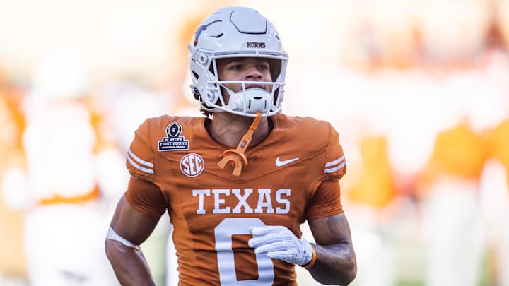 Dec 21, 2024; Austin, Texas, USA; Texas Longhorns wide receiver DeAndre Moore Jr. (0) against the Clemson Tigers during the CFP National playoff first round at Darrell K Royal-Texas Memorial Stadium. Mandatory Credit: Mark J. Rebilas-Imagn Images