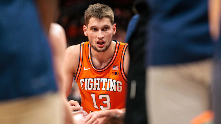 Nov 28, 2024; Kansas City, Missouri, USA; Illinois Fighting Illini center Tomislav Ivisic (13) during a time out against the Arkansas Razorbacks during the first half at T-Mobile Center. Mandatory Credit: William Purnell-Imagn Images Nov 28, 2024; Kansas City, Missouri, USA; Illinois Fighting Illini center Tomislav Ivisic (13) during a time out against the Arkansas Razorbacks during the first half at T-Mobile Center. Mandatory Credit: William Purnell-Imagn Images
