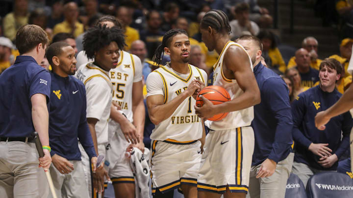 Feb 28, 2026; Morgantown, West Virginia, USA; West Virginia Mountaineers guard Jasper Floyd (1) celebrates with West Virginia Mountaineers forward Brenen Lorient (0) during the second half against the BYU Cougars at Hope Coliseum. Feb 28, 2026; Morgantown, West Virginia, USA; West Virginia Mountaineers guard Jasper Floyd (1) celebrates with West Virginia Mountaineers forward Brenen Lorient (0) during the second half against the BYU Cougars at Hope Coliseum.