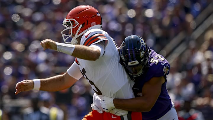 Sep 14, 2025; Baltimore, Maryland, USA;  Cleveland Browns quarterback Joe Flacco (15) is hit by Baltimore Ravens linebacker Kyle Van Noy (53) during the first quarter at M&T Bank Stadium. Mandatory Credit: Peter Casey-Imagn Images
