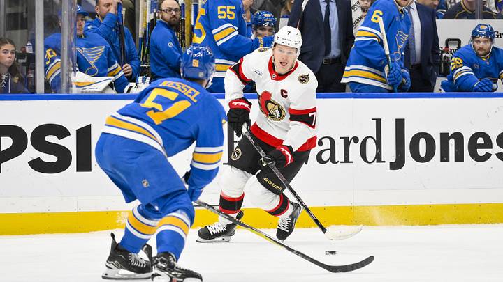 Nov 28, 2025; St. Louis, Missouri, USA; Ottawa Senators left wing Brady Tkachuk (7) controls the puck as St. Louis Blues defenseman Matthew Kessel (51) defends during the first period at Enterprise Center. Mandatory Credit: Jeff Curry-Imagn Images