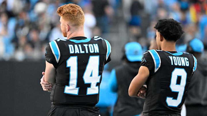 Nov 3, 2024; Charlotte, North Carolina, USA; Carolina Panthers quarterback Andy Dalton (14) and quarterback Bryce Young (9) on the sidelines in the fourth qarter at Bank of America Stadium. Mandatory Credit: Bob Donnan-Imagn Images