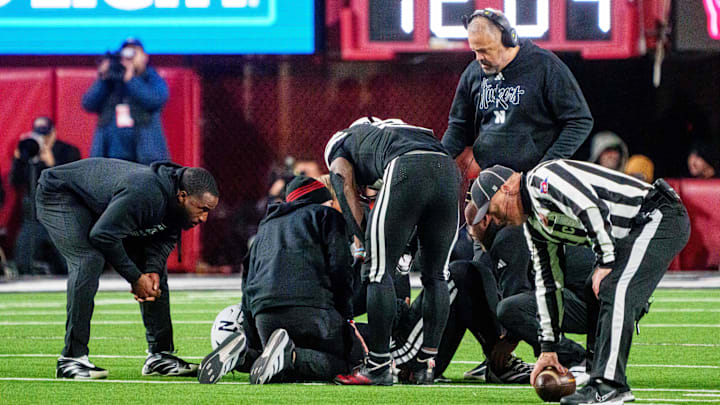 Nebraska Cornhuskers head coach Matt Rhule looks on as  quarterback Dylan Raiola is attended to after his third-quarter injury Saturday night against the USC Trojans.