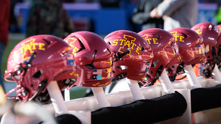 Nov 9, 2024; Kansas City, Missouri, USA; Iowa State Cyclones helmets on the bench during the first quarter against the Kansas Jayhawks at GEHA Field at Arrowhead Stadium. Mandatory Credit: William Purnell-Imagn Images
