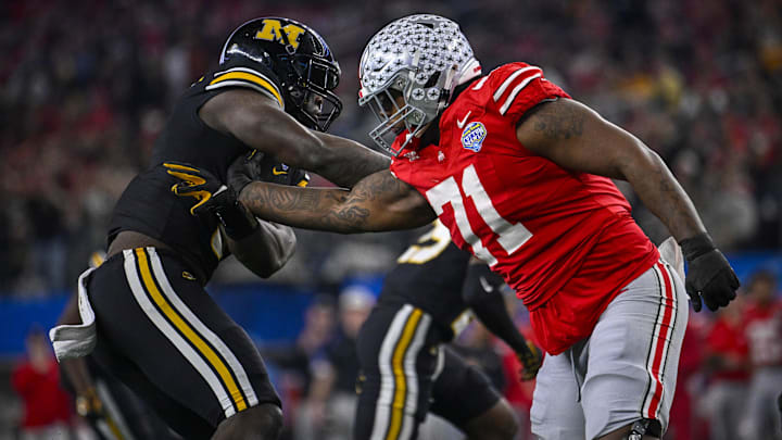 Dec 29, 2023; Arlington, TX, USA; Ohio State Buckeyes offensive lineman Josh Simmons (71) blocks Missouri Tigers defensive lineman Darius Robinson (6) during the second quarter at AT&T Stadium. Mandatory Credit: Jerome Miron-Imagn Images