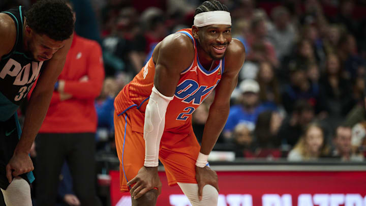 Nov 30, 2025; Portland, Oregon, USA; Oklahoma City Thunder guard Shai Gilgeous-Alexander (2) smiles at a fan during the second half in a game against the Portland Trail Blazers at Moda Center. Mandatory Credit: Troy Wayrynen-Imagn Images