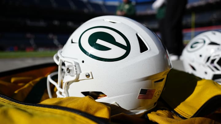 Dec 14, 2025; Denver, Colorado, USA; General view of Green Bay Packers helmets before the game against the Denver Broncos at Empower Field at Mile High. Mandatory Credit: Ron Chenoy-Imagn Images