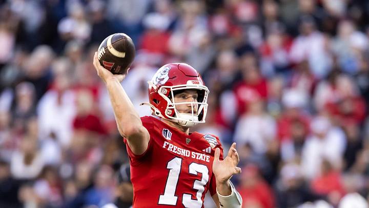 Dec 27, 2025; Tucson, AZ, USA; Fresno State Bulldogs quarterback E.J. Warner (13) against the Miami (OH) RedHawks during the Snoop Dogg Arizona Bowl at Casino Del Sol Stadium. Mandatory Credit: Mark J. Rebilas-Imagn Images