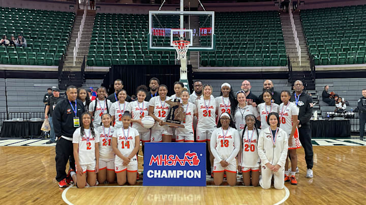 The Belleville Tigers pose for a picture after winning the Division 1 MHSAA girls basketball state championship on Saturday, March 22, 2025, at the Breslin Center in East Lansing, Michigan. The Belleville Tigers pose for a picture after winning the Division 1 MHSAA girls basketball state championship on Saturday, March 22, 2025, at the Breslin Center in East Lansing, Michigan.