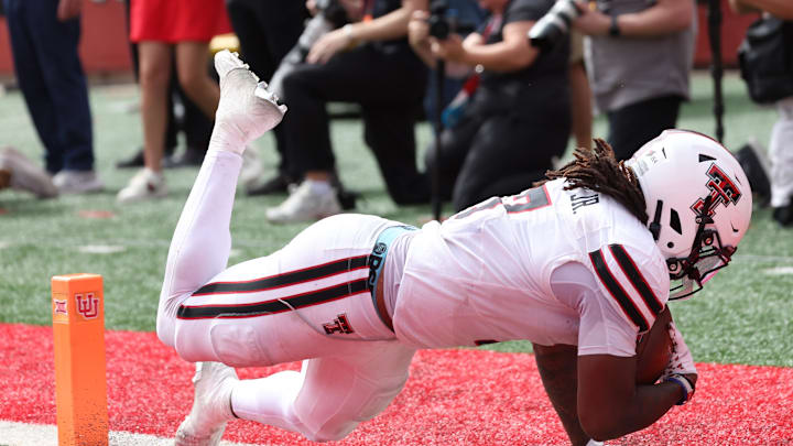 Sep 20, 2025; Salt Lake City, Utah, USA; Texas Tech Red Raiders tight end Terrance Carter Jr. (7) scores a touchdown against the Utah Utes during the fourth quarter at Rice-Eccles Stadium. Mandatory Credit: Rob Gray-Imagn Images