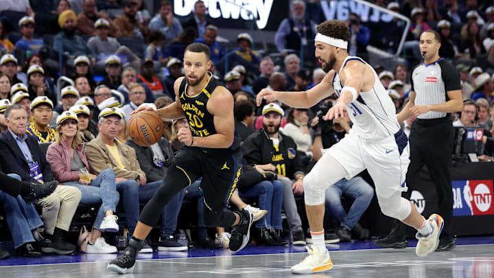 Stephen Curry drives against Klay Thompson during a matchup between the Golden State Warriors and Dallas Mavericks