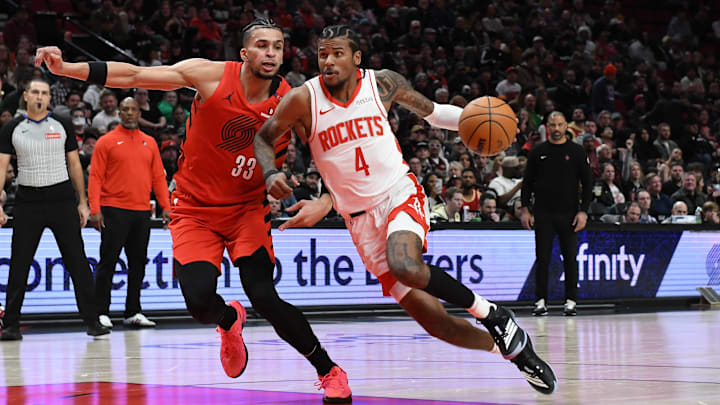 Jan 18, 2025; Portland, Oregon, USA; Houston Rockets guard Jalen Green (4) drives to the hoop against Portland Trail Blazers forward Toumani Camara (33) during the first half at Moda Center. Mandatory Credit: Brian Murphy-Imagn Images