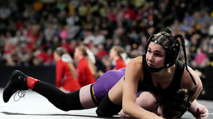 Raccoon River-Northwest’s Katie Biscoglia wrestles Indianola’s Nora Ohnemus in a Class 2A 105-pound semifinal match at the IGHSAU state wrestling tournament Day 2 Friday, Feb. 7, 2025 at Xtream Arena in Coralville, Iowa.