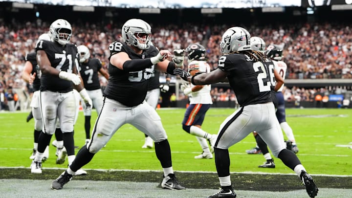 Sep 28, 2025; Paradise, Nevada, USA; Las Vegas Raiders running back Ashton Jeanty (2) celebrates a touchdown with center Jackson Powers-Johnson (58) during the first quarter against the Chicago Bears at Allegiant Stadium. Mandatory Credit: Stephen R. Sylvanie-Imagn Images Sep 28, 2025; Paradise, Nevada, USA; Las Vegas Raiders running back Ashton Jeanty (2) celebrates a touchdown with center Jackson Powers-Johnson (58) during the first quarter against the Chicago Bears at Allegiant Stadium. Mandatory Credit: Stephen R. Sylvanie-Imagn Images