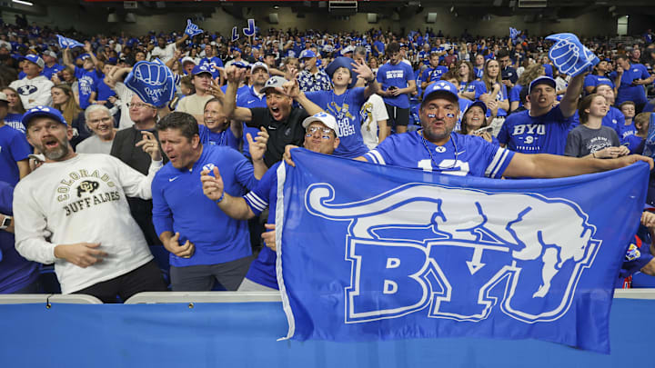 Dec 28, 2024; San Antonio, TX, USA; Brigham Young Cougars fans cheer during the fourth quarter of the game against the Colorado Buffaloes at Alamodome. Mandatory Credit: Troy Taormina-Imagn Images