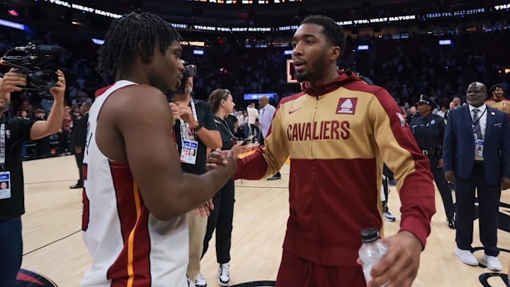 Apr 28, 2025; Miami, Florida, USA; Cleveland Cavaliers guard Donovan Mitchell (45) shakes hands with Miami Heat guard Davion Mitchell (45) after game four for the first round of the 2025 NBA Playoffs at Kaseya Center. Mandatory Credit: Sam Navarro-Imagn Images Apr 28, 2025; Miami, Florida, USA; Cleveland Cavaliers guard Donovan Mitchell (45) shakes hands with Miami Heat guard Davion Mitchell (45) after game four for the first round of the 2025 NBA Playoffs at Kaseya Center. Mandatory Credit: Sam Navarro-Imagn Images